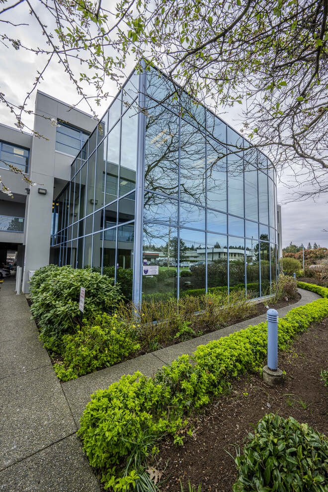 glass building with shrubbery